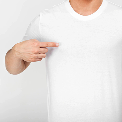 A man pointing to his chest wearing a white shirt.