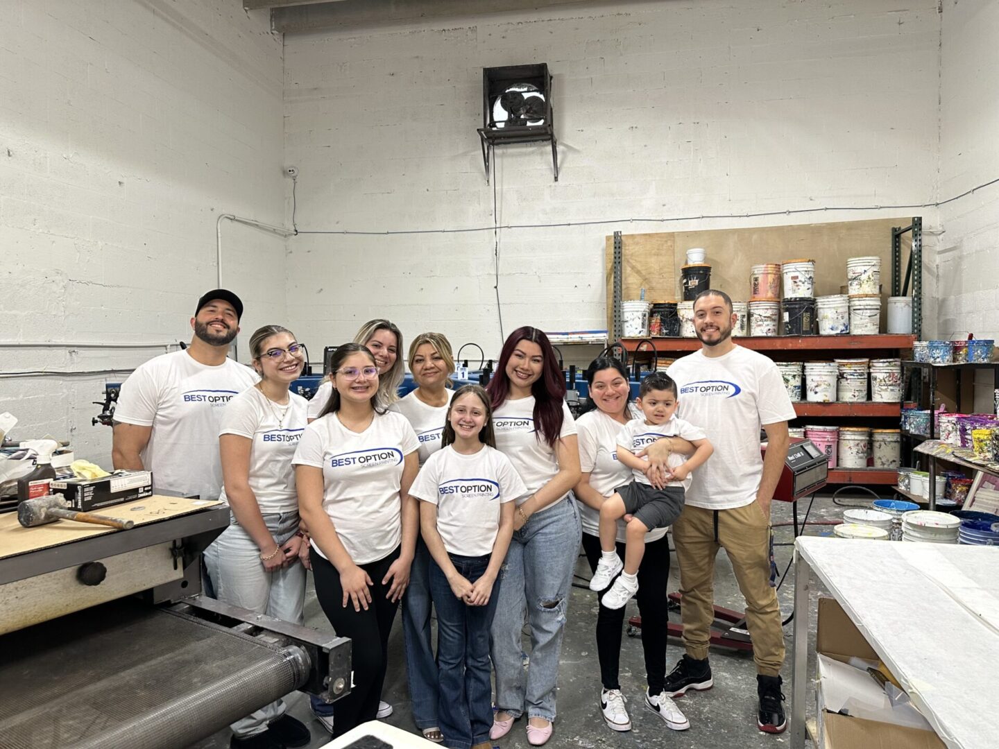 A group of people standing in a room.