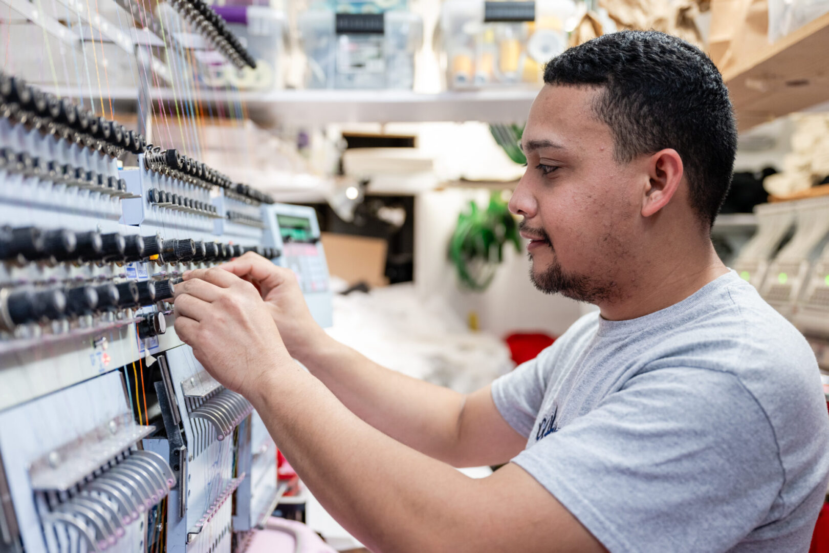 A man is looking at the electrical equipment.