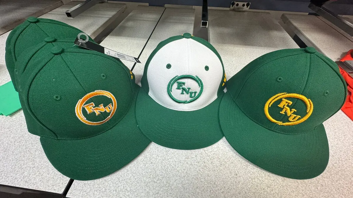 Three green hats with a batman logo on each.