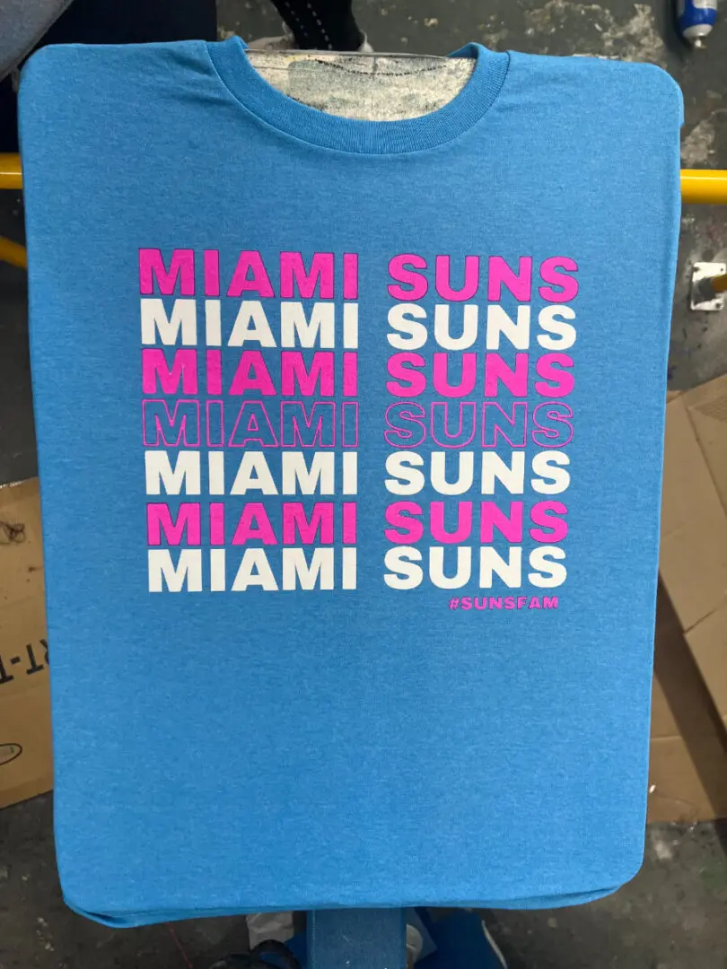 A blue bag with the words " miami suns ".